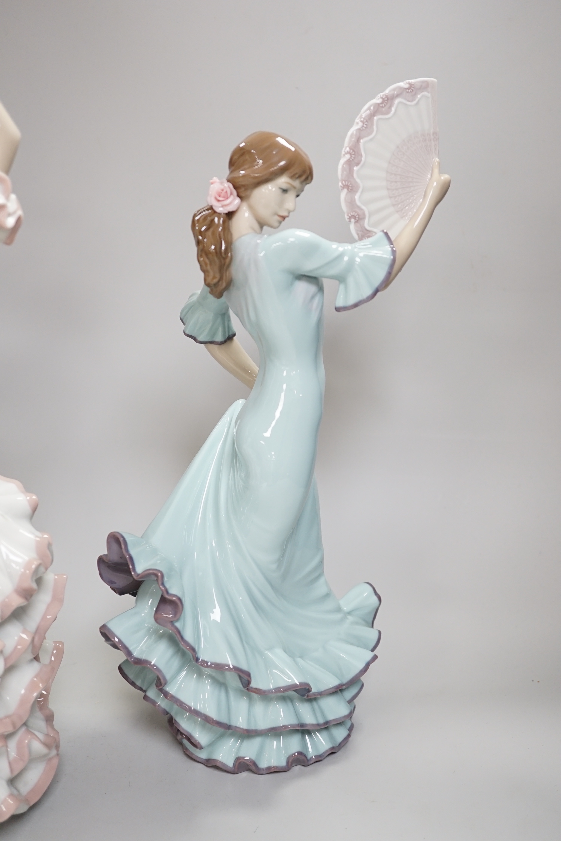 A Lladro centrepiece of two Spanish dancers, ‘A Passionate Dance’, boxed, together with another Lladro dancing figure with a fan, highest 43.5cm